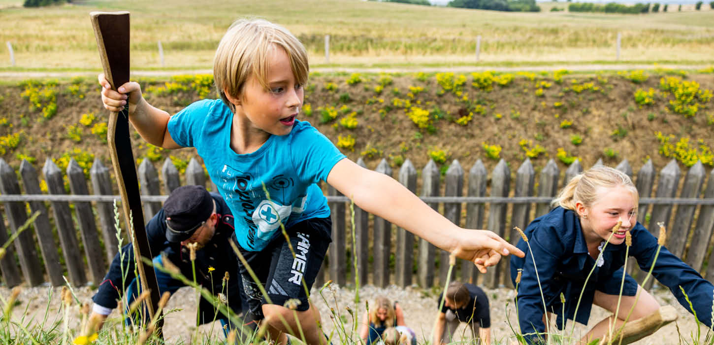 Children climbing the entrenchment at History Centre Dybbøl Banke