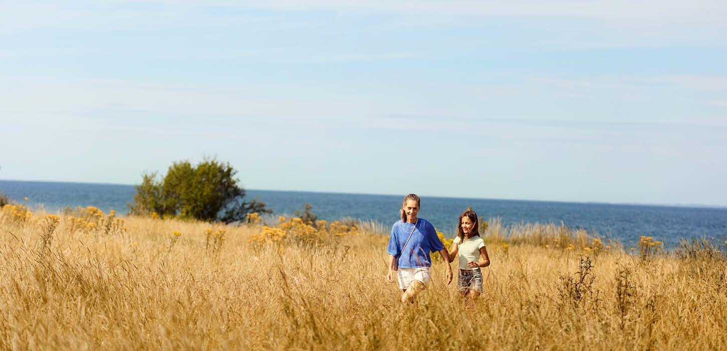 Two people in a field at Center Parcs Nordborg Resort.
