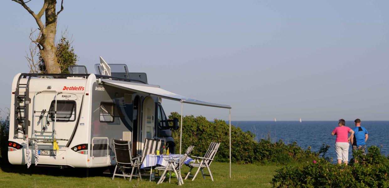 Campervans near the water at Drejby Strand Camping