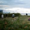 Playing near the tent and pop-up camper at Drejby Strand Camping