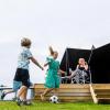 Children playing football in front of MOJN tent at Lærkelunden Camping