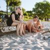 Family on the beach with bonfire and cycles