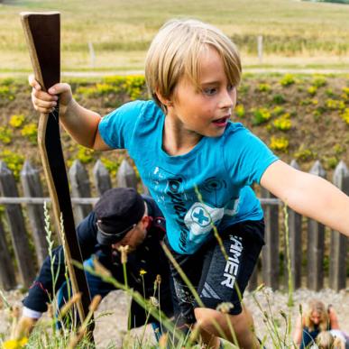 Children climbing the entrenchment at History Centre Dybbøl Banke