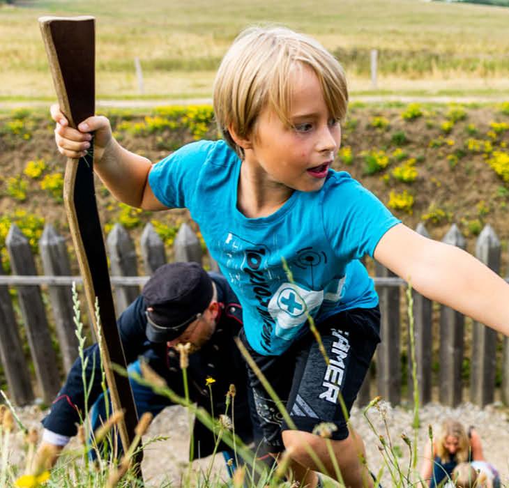 Children climbing the entrenchment at History Centre Dybbøl Banke